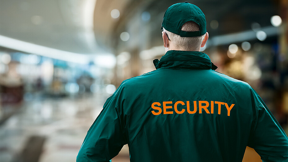 1303166941 Security Man Looking At Moscow Kremlin And St Basil's Cathedral